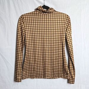 ROKH.. mask, houndstooth, turtleneck top..